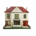 The Copper Kettle, a dolls’ house tea room, the post-war wooden cream painted house with red roof,