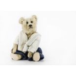 An early German teddy bear 1910-20s, with blonde mohair, black boot button eyes, pronounced