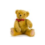 A fine Dean’s Rag Book Co. mouse-eared teddy bear 1950s, with golden mohair, orange and black