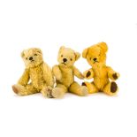 Three post-war British teddy bears: a Chad Valley with dark blonde mohair, orange and black glass