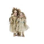 Two German bisque headed child dolls: a Simon & Halbig 1079 DEP with blue lashed sleeping eyes,