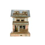 A Bliss (American) dolls’ house, of printed colour paper covered wood with veranda and balcony, blue