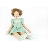 A large Dean’s Rag Book Co. girl doll, with pressed felt face, brown painted side glancing eyes,