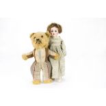A 2nd World War British teddy bear, with golden mohair head, hands and fronts of feet, orange and