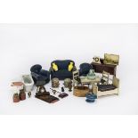 First quarter 20th century dolls’ house furniture: a blue velvet three piece suit, a German lead