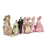 A dolls’ house wedding party, the bisque shoulder head groom with moulded and painted moustache,