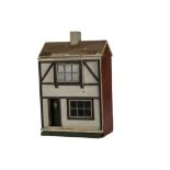 A small Lines 1920s dolls’ house, with front door with lion mask, half-timbered pebble-dashed