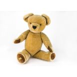 A large Merrythought teddy bear, with golden mohair, jointed, velvet pads and golden label -36in. (