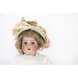 A large Simon & Halbig for Kämmer & Reinhardt child doll, with blue lashed sleeping eyes, blonde