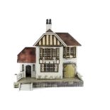 A British-market Gottschalk 1930s dolls’ house, with painted red tiled roof, grey pebble-dashed