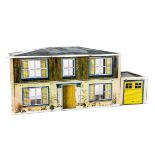 A Mettoy lithographed tinplate dolls’ house, with printed interior including nursery and fully-