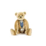A fine early Steiff teddy bear, with golden mohair, black boot button eyes, pronounced slightly