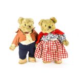 A pair of amusing Continental Mr. & Mrs. teddy bear mid 20th century, with yellow artificial silk