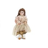 A S.F.B.J. child doll, with dark sleeping eyes, pierced ears, replaced brown wig, jointed papier-