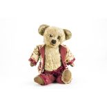 An early British teddy bear 1920s, with blonde mohair, clear and black glass eyes with brown painted