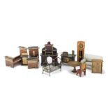 German dolls’ house furniture: a tinplate bed with angel motif at each end -4in. (10cm.) long, an