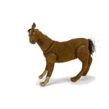 A rare Steiff jointed brown burlap horse, with black boot button eyes, white burlap flash and