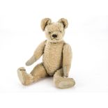 A French Fadap teddy bear 1920s, with blonde mohair, clear and black glass eyes, black stitched
