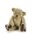 ‘Griffin’ an unusual 1920s British teddy bear, with blonde mohair, clear and black glass eyes with