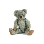 A rare Chad Valley blue mohair teddy bear 1930s, with orange and black glass eyes, pronounced