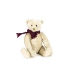 A fine 1920s Steiff white mohair teddy bear, with brown and black glass eyes, pronounced slightly