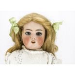 A Simon & Halbig 1078 child doll, with replaced blue glass eyes and blonde wig, jointed