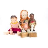 Various dolls: a composition headed googly doll with celluloid floating pupil on cloth body with