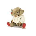 An amusing jointed soft toy elephant, possibly French with grey cotton plush, blue and black glass