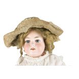 An Armand Marseille 390n child doll, with blue lashed sleeping eyes, remains of blonde mohair wig,