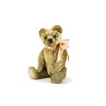 A fine Omega teddy bear 1920s, with dark blonde mohair, clear and black glass eyes with brown