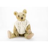 An early Omega teddy bear 1920s, with golden mohair, clear and black glass eyes, pronounced