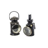 Two Railway Signal Oil lamps, both black painted one stamped B.R. with brass mounts and interior