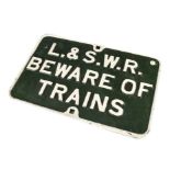 An original cast iron LSWR ‘Beware of Trains’ sign, in repainted green and white, VG