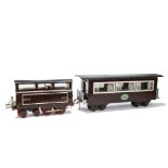An Early 2½” Gauge 3-rail Freelance Electric 4-4-0 Locomotive and Coach with Carrying Case, believed