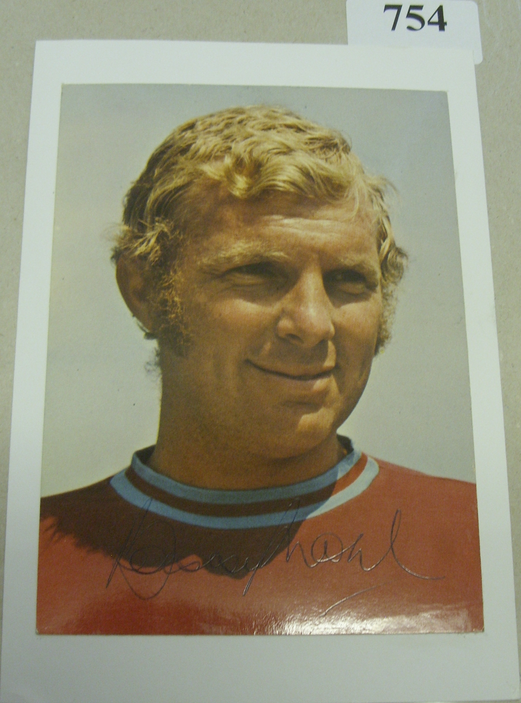 Bobby Moore, West Ham Utd, a fine example of Bobby's autograph upon a Coffer postcard, laid down to