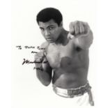 MUHAMMAD ALI AUTOGRAPH A 10" X 8" black and white photograph in fighter pose dedicated "To Justin