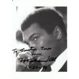 MUHAMMAD ALI AUTOGRAPH A 7" X 5" black and white portrait photograph dedicated "To Justin Jones from