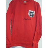 BOBBY CHARLTON SIGNED SHIRT A replica red long sleeve England World Cup 1966 Final shirt with number