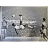 PELE AUTOGRAPHED CANVAS A large 28" X 24" black & white action canvas showing Pele executing an