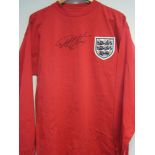 GEOFF HURST SIGNED SHIRT A replica red long sleeve England World Cup 1966 Final shirt with number 10