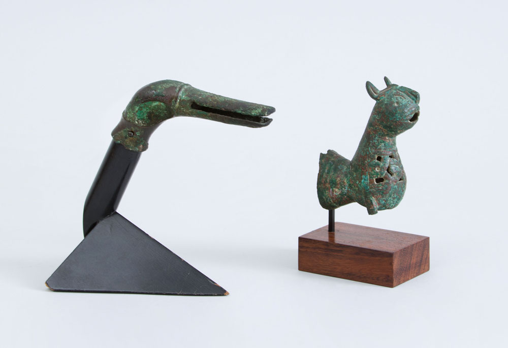 EGYPTIAN BRONZE DUCK HEAD HANDLE AND A BRONZE FIGURE OF A FELINE