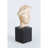 GREEK CARVED MARBLE HEAD OF A WOMAN, HELLENISTIC