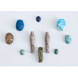 GROUP OF THREE EGYPTIAN FAIENCE USHBATIU AND SEVEN GLAZED FAIENCE SCARABS