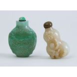 TWO CHINESE CARVED JADE SNUFF BOTTLES AND STOPPERS