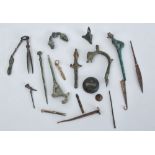 MISCELLANEOUS GROUP OF ANCIENT BRONZE FIBULAE AND METAL FRAGMENTS