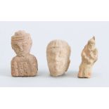 TWO CARVED STONE FIGURAL FRAGMENTS