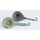 TWO ETRUSCAN BRONZE STRAINERS