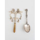 CONTINENTAL SILVERED METAL RATTLE AND SILVER SPOON