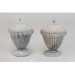 PAIR OF NEOCLASSICAL STYLE LEAD COVERED URNS AND COVERS