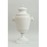 CONTINENTAL IVORY-GLAZED FAIENCE URN AND COVER